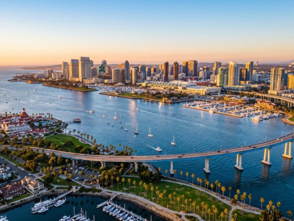 San Diego and Tijuana border region at golden hour with the city skyline, representing cross-border real estate investment from Mexico into San Diego